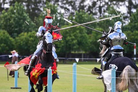 Two medieval knights confront during jousting tournament Stock Photos