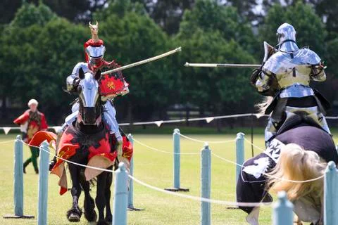 Two medieval knights confront during jousting tournament Stock Photos