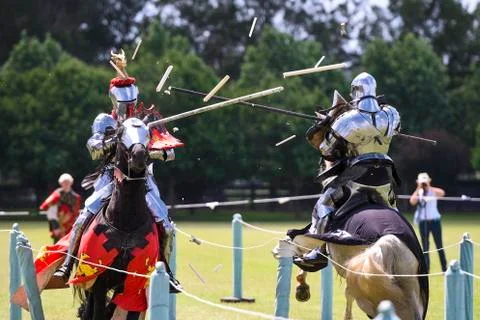 Two medieval knights confront during jousting tournament Stock Photos