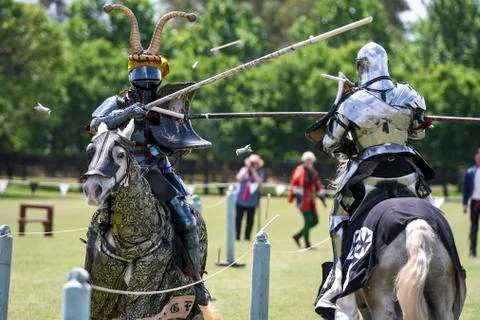 Two medieval knights confront during jousting tournament Stock Photos