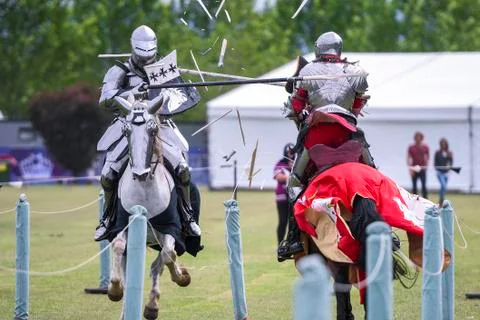 Two medieval knights confront during jousting tournament Stock Photos