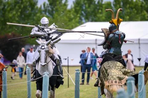 Two medieval knights confront during jousting tournament Stock Photos