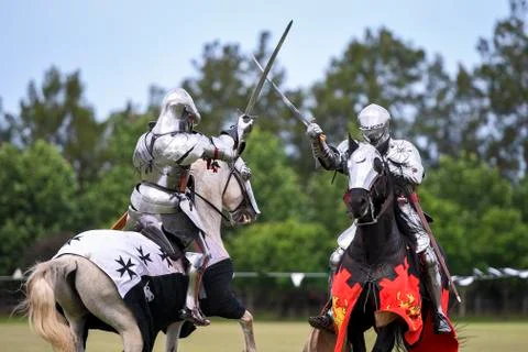 Two medieval knights confront during jousting tournament Stock Photos