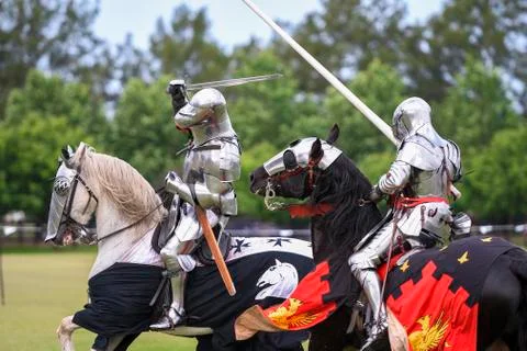 Two medieval knights confront during jousting tournament Stock Photos