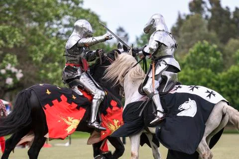 Two medieval knights confront during jousting tournament Stock Photos