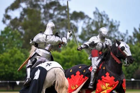 Two medieval knights confront during jousting tournament Stock Photos