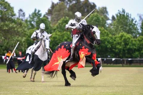 Two medieval knights confront during jousting tournament Stock Photos