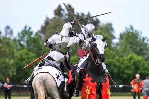 Two medieval knights confront during jousting tournament Stock Photos