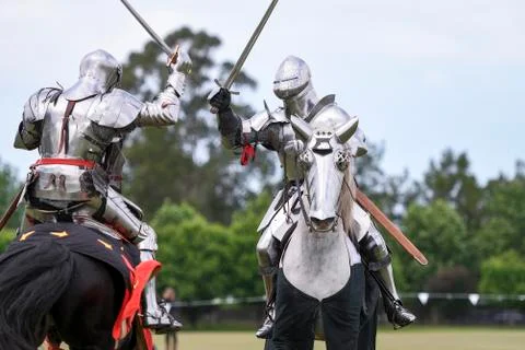 Two medieval knights confront during jousting tournament Stock Photos