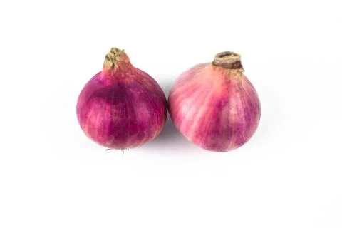 Two medium size fresh and ripe red onion isolated on a white background Stock Photos