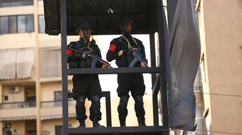 Two members of Hezbollah' Strike Force guarding the ceremony Stock Footage 63504442