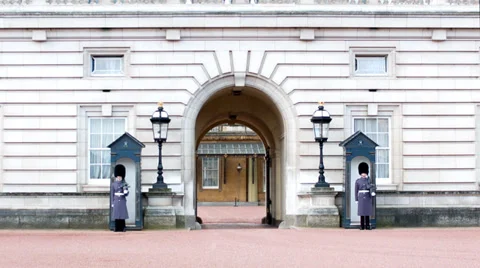 Two Members of the Queen's Guard outside Buckingham Palace (2) - London UK Stock Footage 36321024