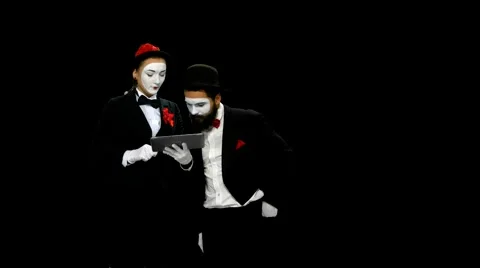 Two memes watches something using tablet computer, alpha channel Stock-Footage 47924839