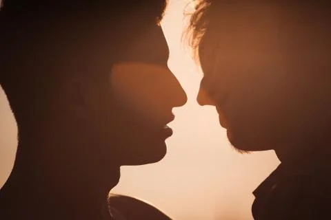 Two men about to kiss Stock Photos