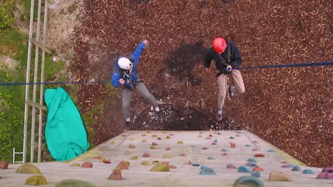 Two men abseiling Stock Footage 236712399