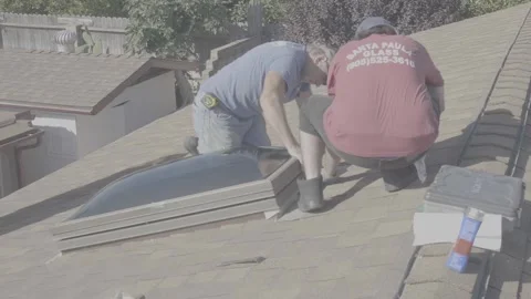 Two Men Adjusting a Large Skylight Glass Window on a Rooftop (RAW) Stock Footage 212417753