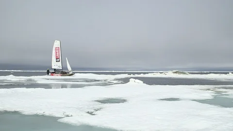 Two men and a catamaran on the ice floe, North Pole Stock Footage 104915230