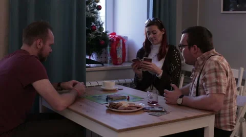 Two men and women play a board game Stock Footage 59162889