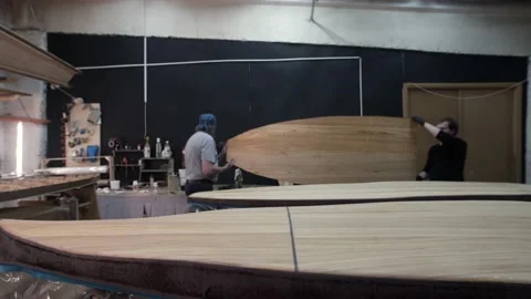 Two men applied the top Board surf Board Video stock 132258413