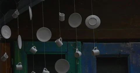 Two Men are Passing by Camera, White Mugs, White Saucers, Hunging Under The Video stock 52198084