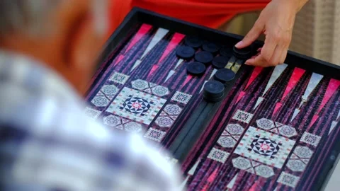 Two men are playing backgammon slow motion Stock Footage 249040813