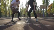 Two Men Are Playing Basketball Outdoors Stock Footage