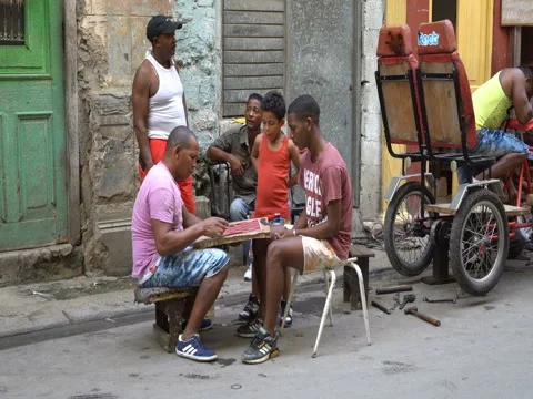 Two men are playing checkers on the street of Havana Stock Footage 71142574