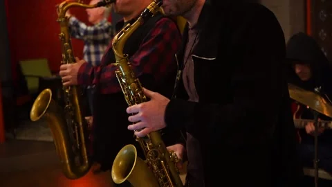 Two men are playing the saxophone Stock Footage 133644574