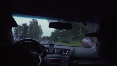 Two men are sitting in the car and talking Video stock 102362619