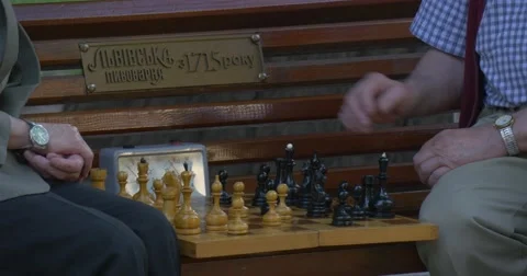 Two Men Are Sitting in Front of Each Other, Playing Chess, Turn Chess Clocks Stock Footage 52195506