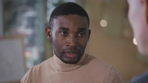 Two men are talking to each other. Workflow communication of two colleagues. Stock Footage 229171943