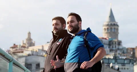 Two men are talking on the terrace in front of Galata Tower. Stock-Footage 162021790