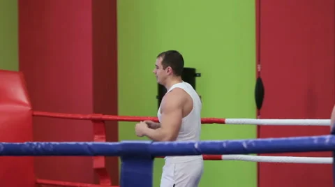 Two men are training in the Boxing ring Stock Footage 59856740