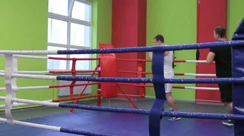 Two men are training in the Boxing ring Stock Footage 59856782