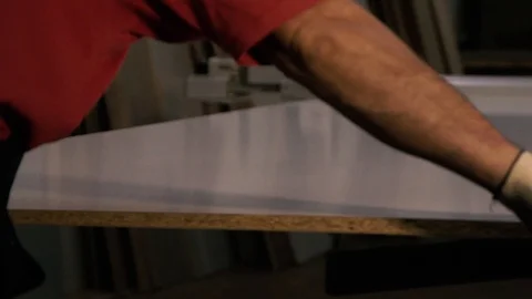 Two men are working at the machine. Processing of wooden structures for the cabi Stock Footage 125427136