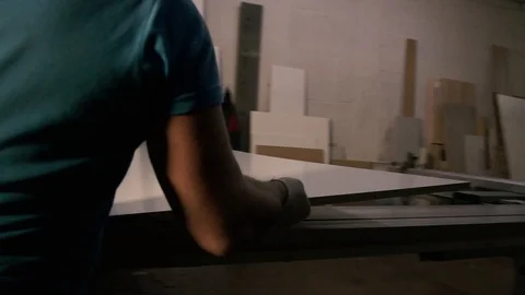 Two men are working at the machine. Processing of wooden structures for the cabi Stock Footage 125427224