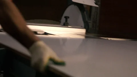 Two men are working at the machine. Processing of wooden structures for the cabi Stock Footage 125427347