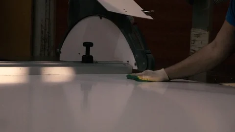 Two men are working at the machine. Processing of wooden structures for the cabi Stock Footage 125427447