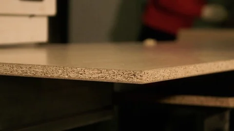 Two men are working at the machine. Processing of wooden structures for the cabi Stock Footage 125427537