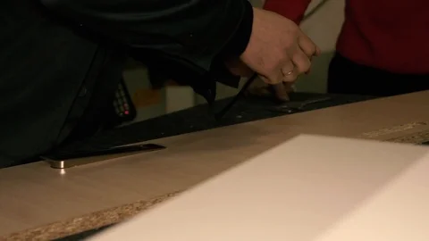 Two men are working at the machine. Stock Footage 125447094