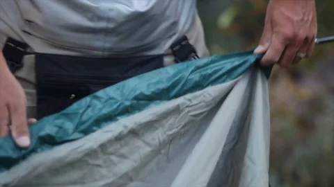 Two men assembling dome tent Stock Footage 82315599