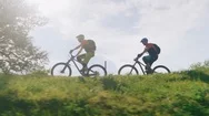 Two Men Biking Riding Uphill On A Mountain Bike Trough The Forest Trails Slow Stock Footage