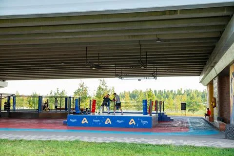 Two men boxing on elevated ring situated under automobile overpass in Astana Stock Photos