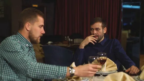 Two men on a business dinner, drink wine Stock Footage 70448637
