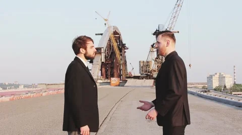Two men in business suits shake hands after making a deal on a job done Stock Footage 62872833