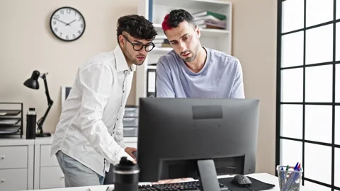Two men business workers using computer working at office Video stock 243492279