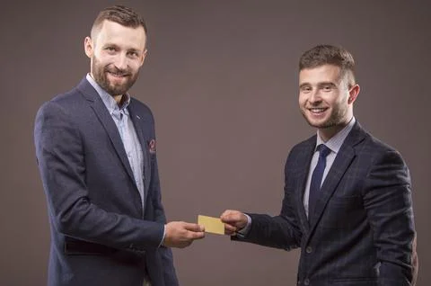Two men with the card in the hands of Stock-Fotos