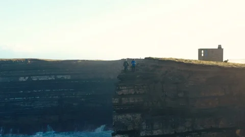 Two Men on a Cliff at Downpatrick Head, Ireland Stock Footage 123445523
