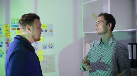 Two men communicate standing at office Stock Footage 62550086