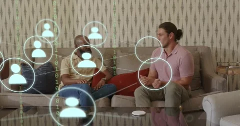 Two men conversing, sparking user-icon circles streaming binary code showing Stock Footage 317733814